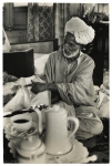 Cloth and Embrodering Merchant Showing his Wares on Houseboat, Kashmir